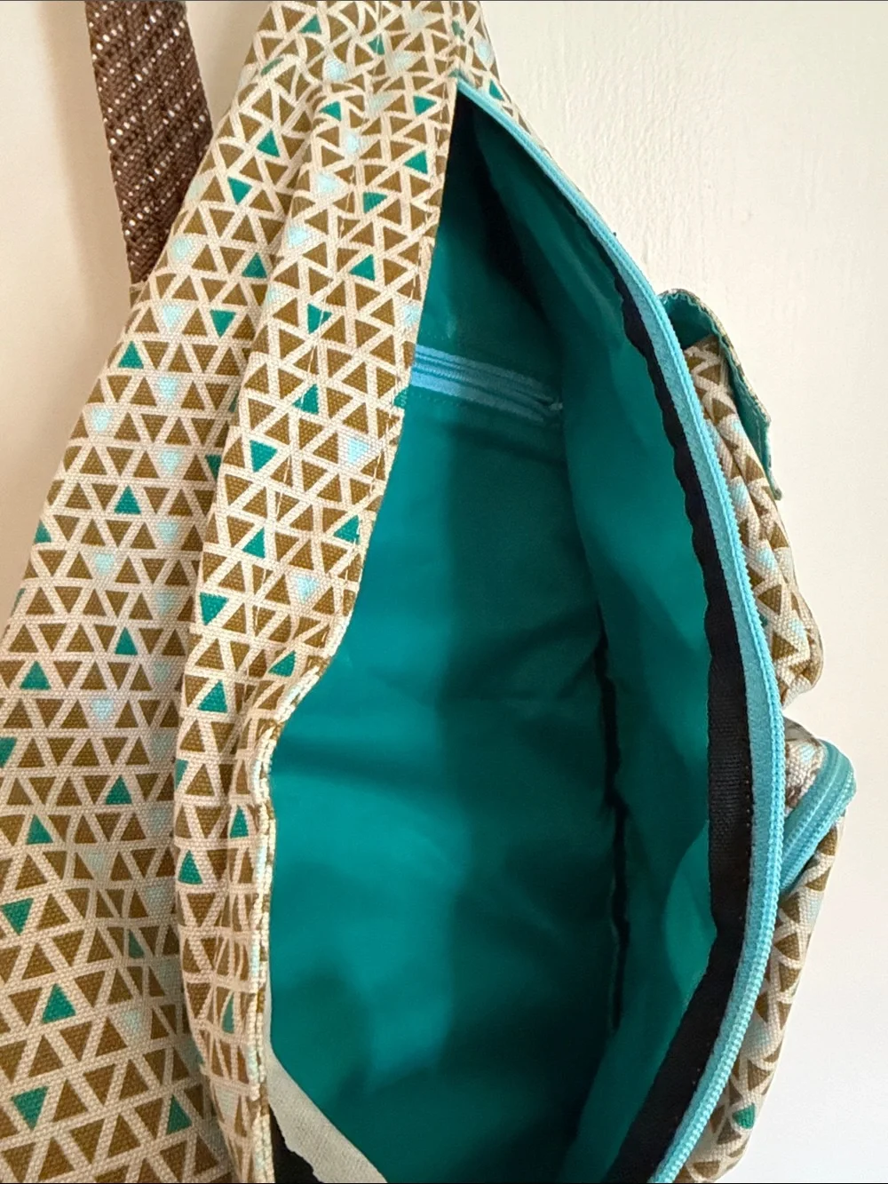 Kavu Beige Sling Bag with Teal Accents